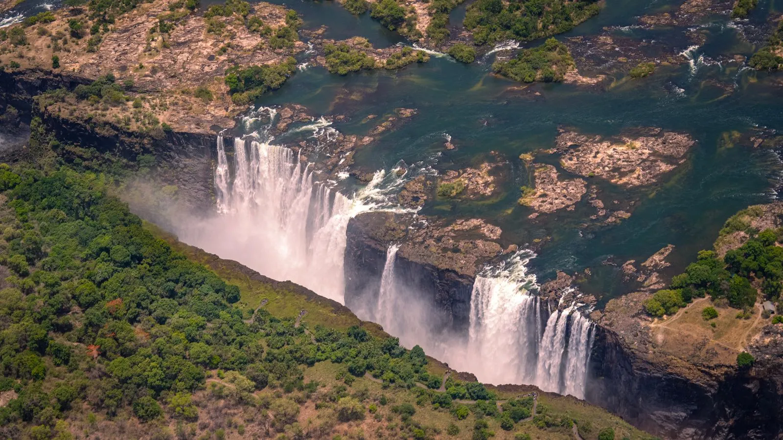 Aerial view of the falls dropping into the gorge, islands in the river above